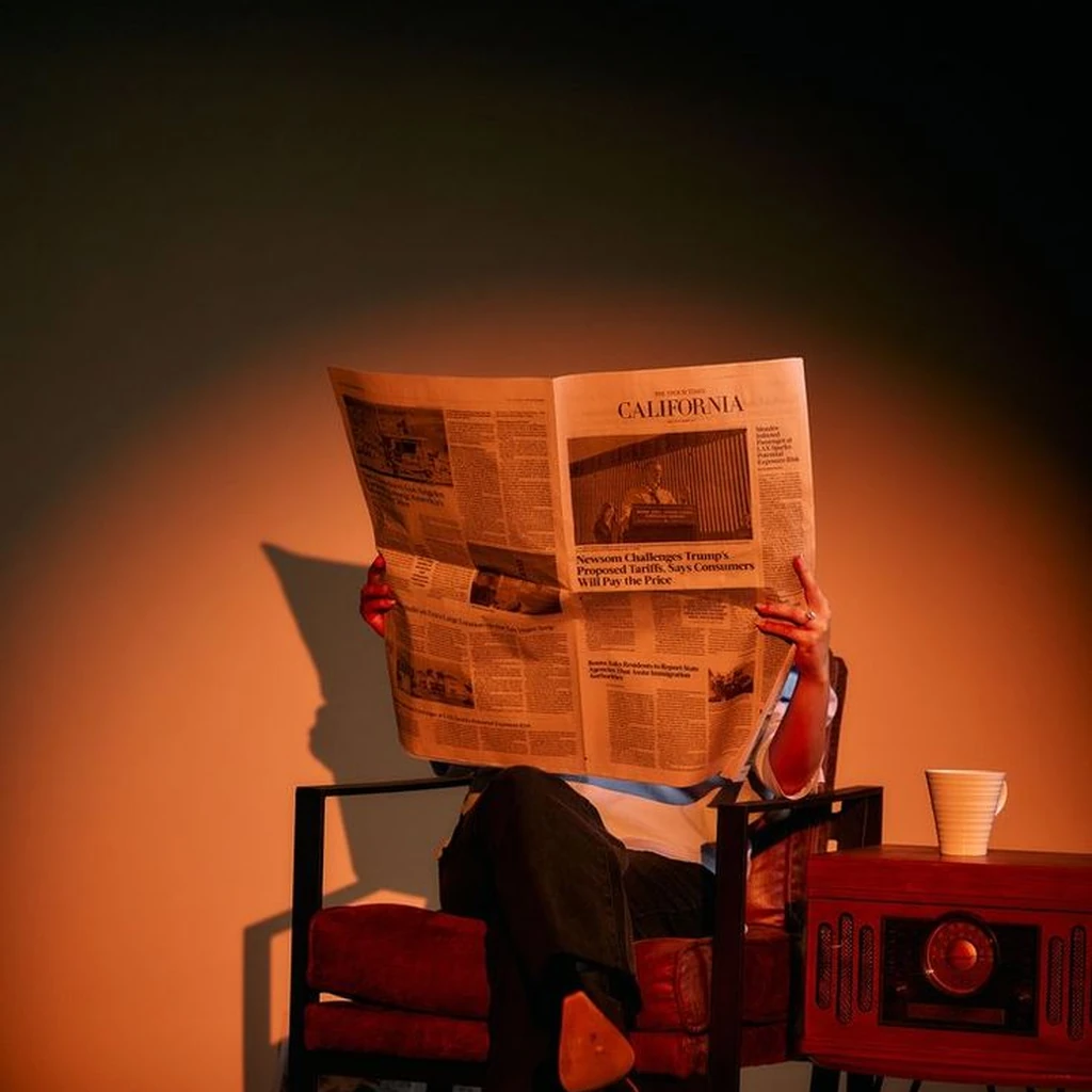 Person reading a newspaper, representing SEO services in Dehradun and digital content visibility.